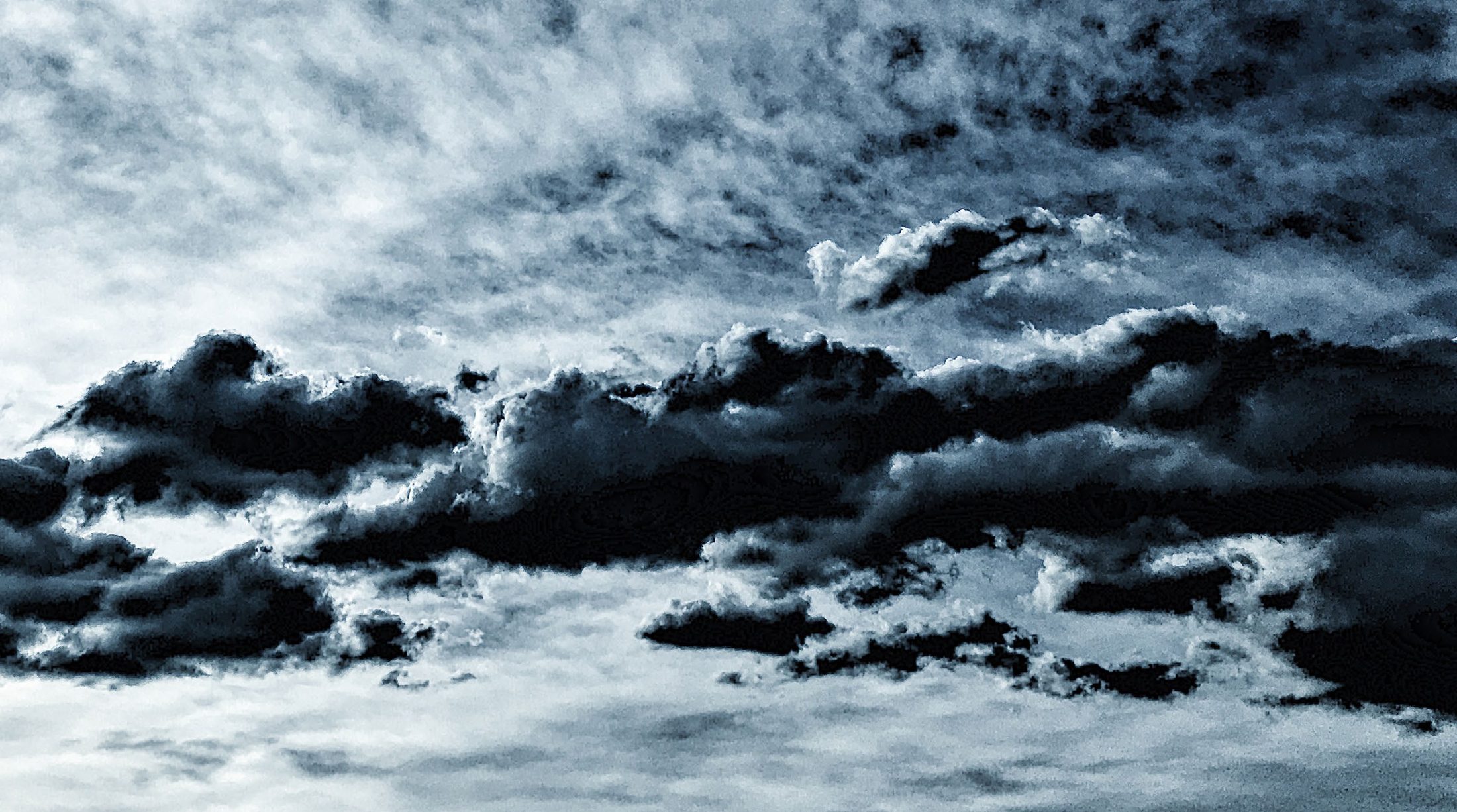 A soft grey sky of layered clouds.